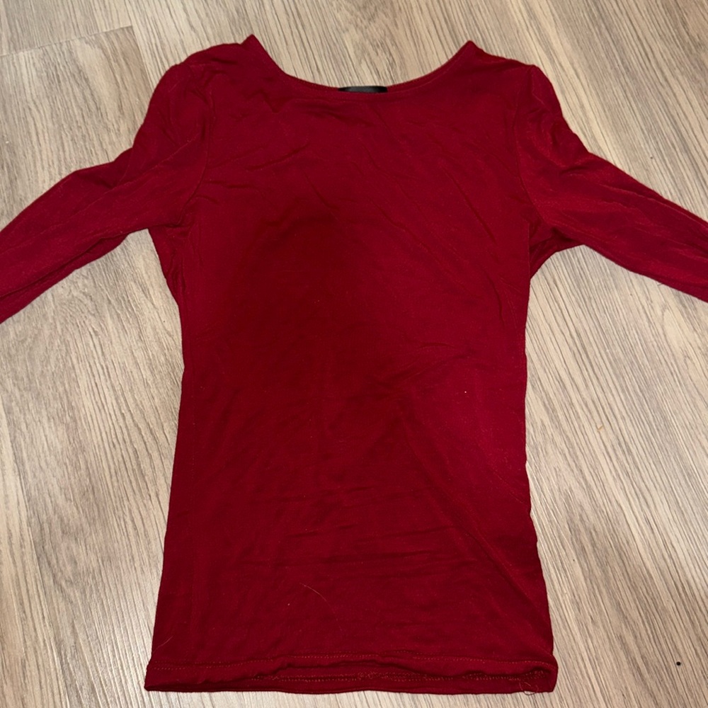 White fox long sleeve top in a deep wine color.